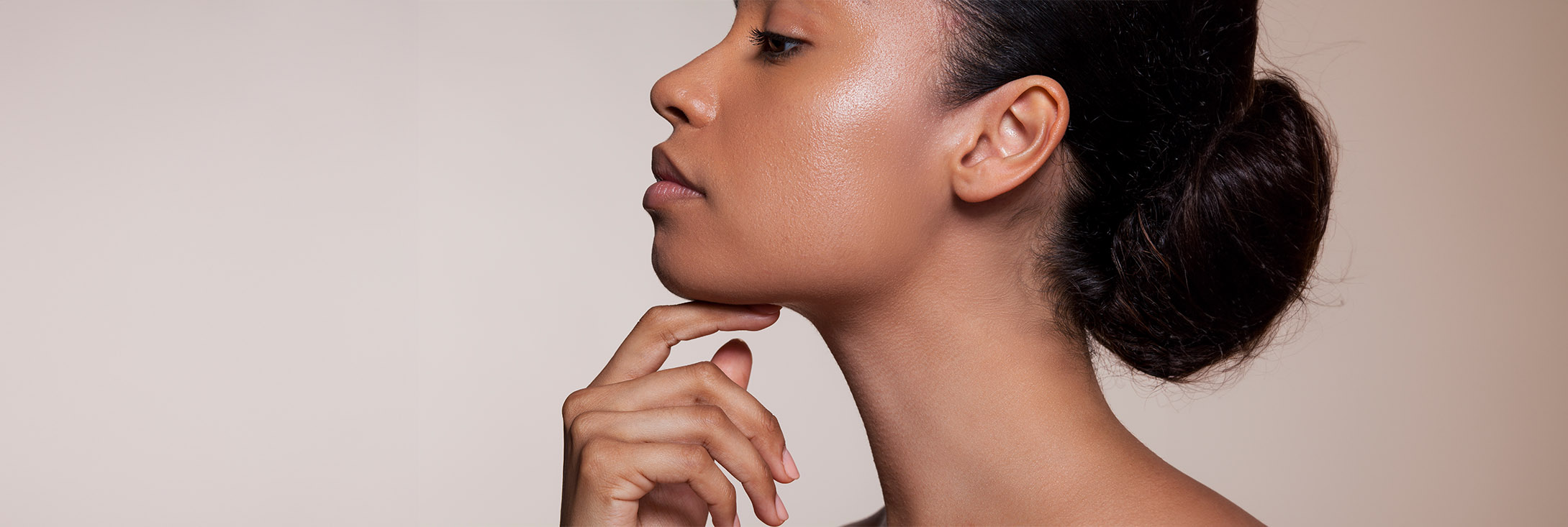 Photo of a woman touching her chin