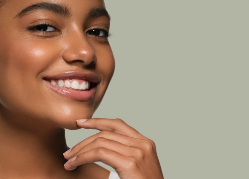 Photo of a young woman touching her chin